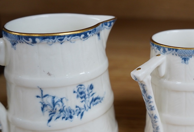 A graduated set of four Royal Worcester blue and white jugs, tallest 11cm. Condition - good.